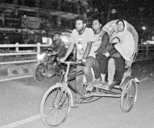 RU student Sanowar on his Rickshaw